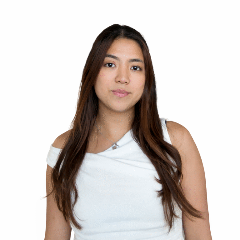 SMSF Accountant Alexis Angeline, standing with long brown hair, wearing a white top, representing the professional team at SMSF Warehouse.