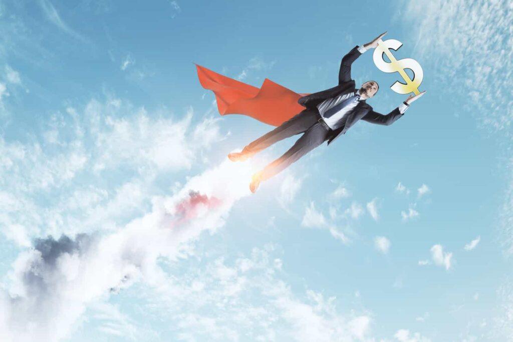 young superhero businessman with golden dollar